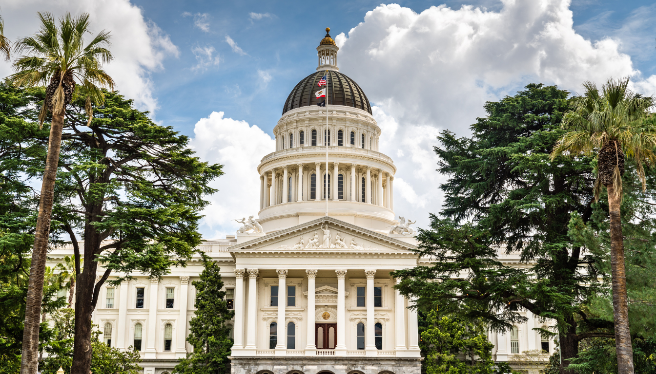The image depicts the California State Capitol dome rising majestically against a clear blue sky, symbolizing the legislative action and advocacy efforts of elected officials and state legislators. This iconic structure serves as a key part of the state's governance, where important meetings and discussions on key issues take place.